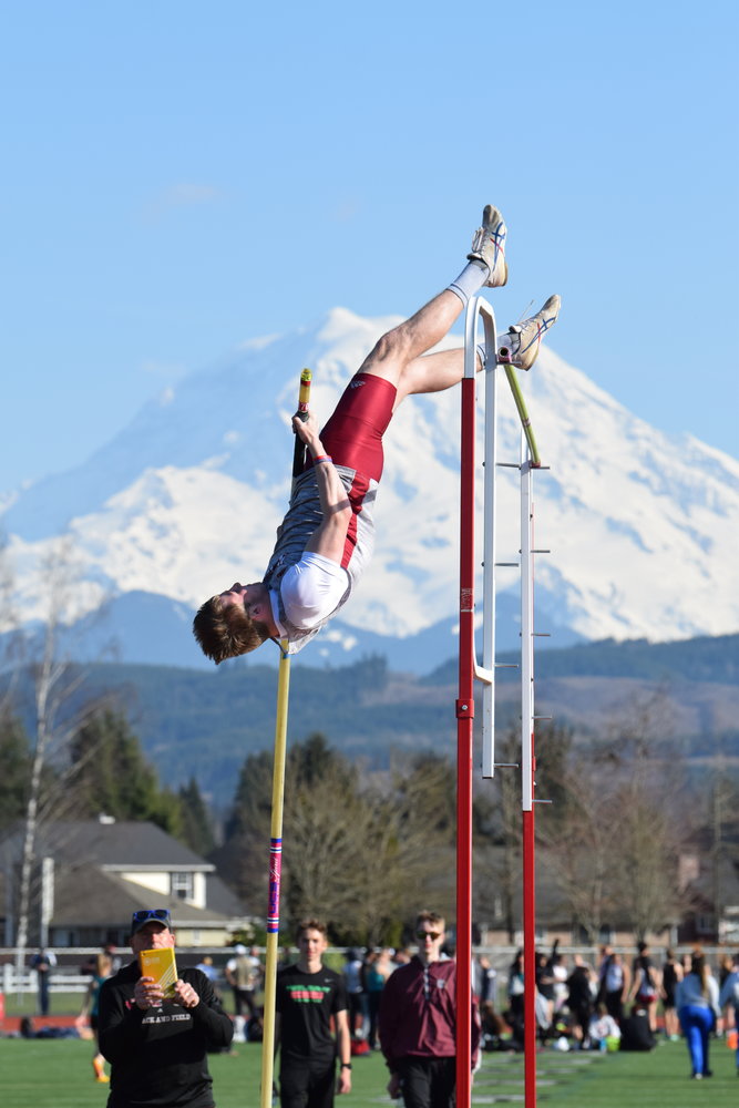 Lucas Hoff goes over the pole vault bar at the Cardinal Relays in Orting on Pattey Hoff for The Chronicle.